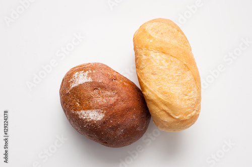 Loafs of bread – brown and white.