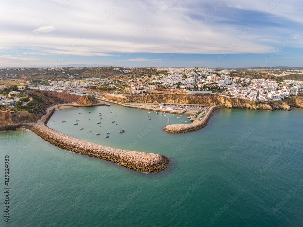 Aerial. Entrance to the port of Albufeira Marina, breakwaters in the foreground.