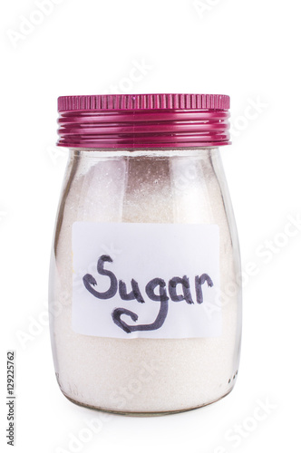 Tablou pe pânză glass jar with sugar. Isolated on white.