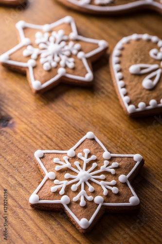 Christmas sweet cakes. Christmas homemade gingerbread cookies on wooden table.