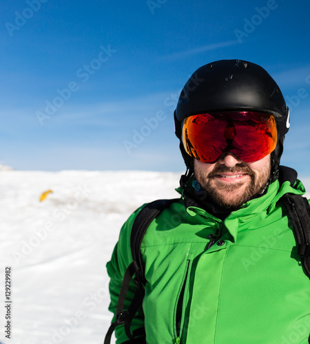 Happy skier with large oversized ski goggles © Mikkel Bigandt