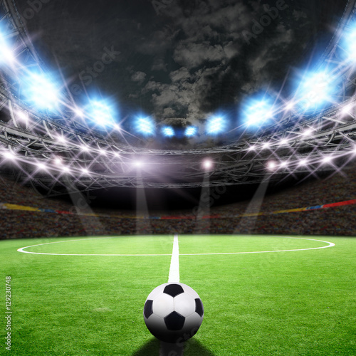 Soccer field with green grass and lights