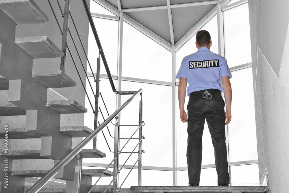 Security man standing on stairs Security man standing on stairs