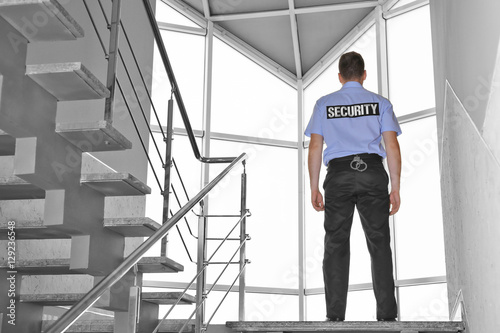 Security man standing on stairs