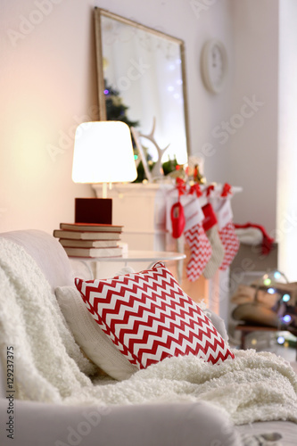 Sofa with plaid and cushion...
