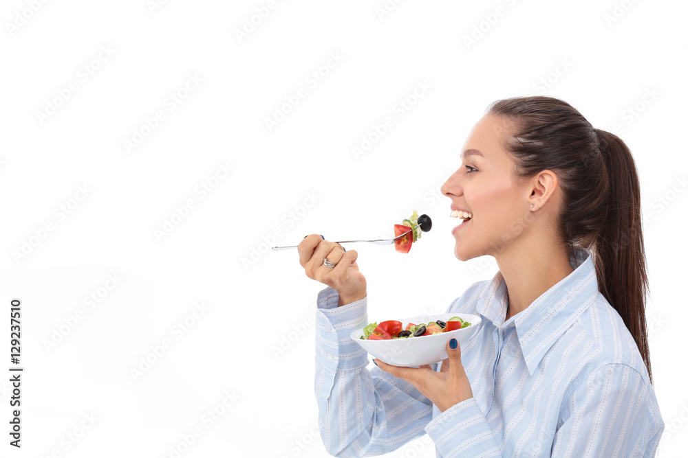 Beautiful girl eating healthy food, isolated on white background Beautiful girl eating healthy food, isolated on white background