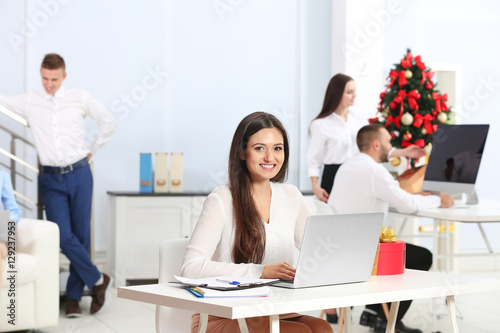 Young woman working with la...