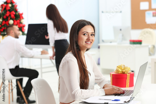 Young woman working with la...