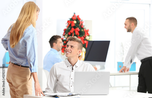 Young colleagues in office ...