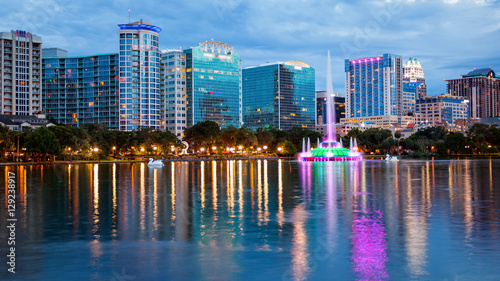 Orlando, Florida City Skyline on Lake Eola as Night Falls (logos blurred for commercial use)