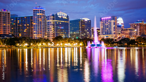 Orlando, Florida City Skyline on Lake Eola at Night (logos blurred for commercial use)