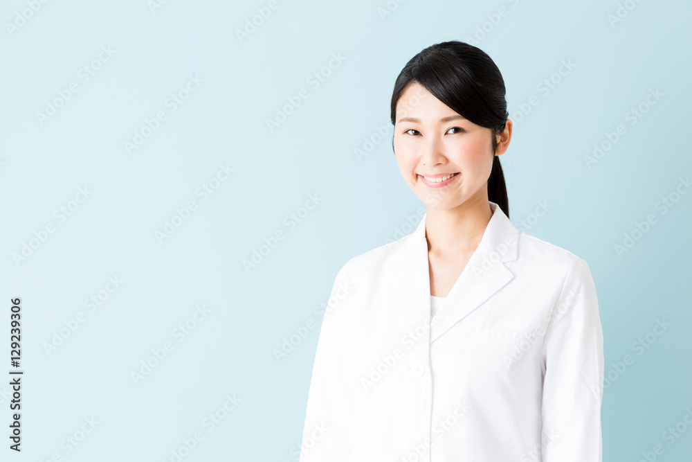 portrait of young asian nurse isolated on blue background portrait of young asian nurse isolated on blue background