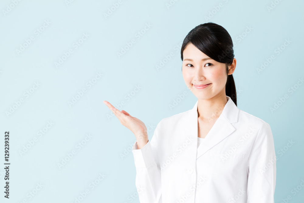 portrait of young asian nurse isolated on blue background portrait of young asian nurse isolated on blue background
