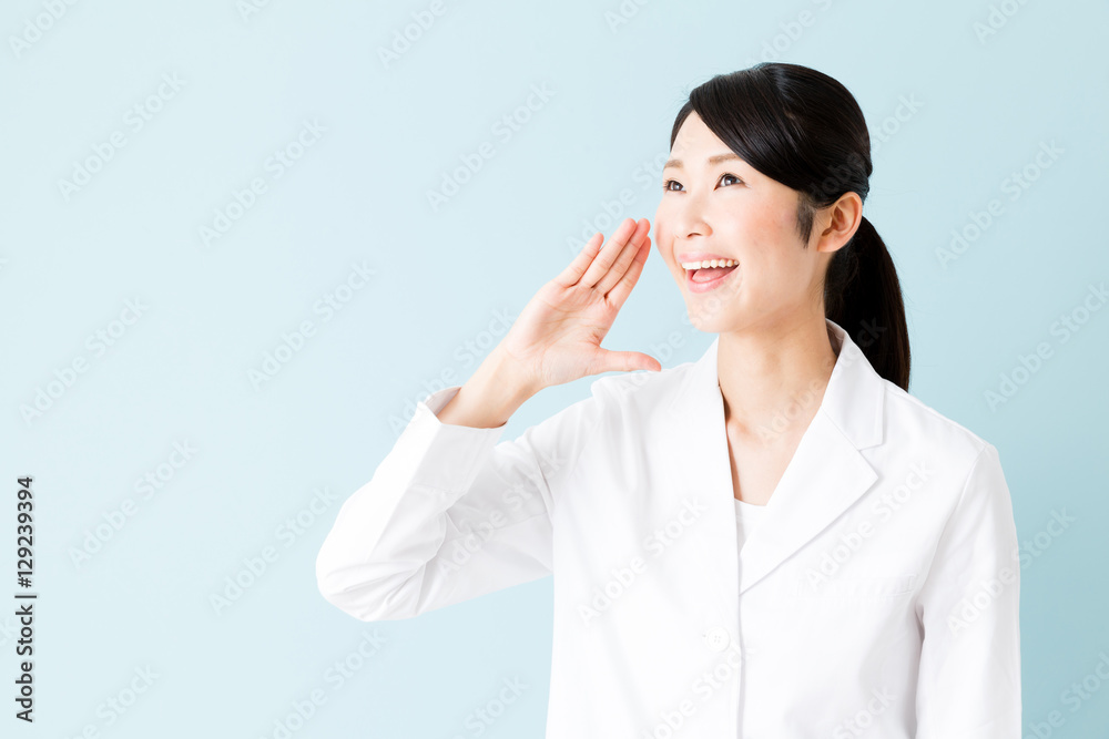 portrait of young asian nurse isolated on blue background portrait of young asian nurse isolated on blue background