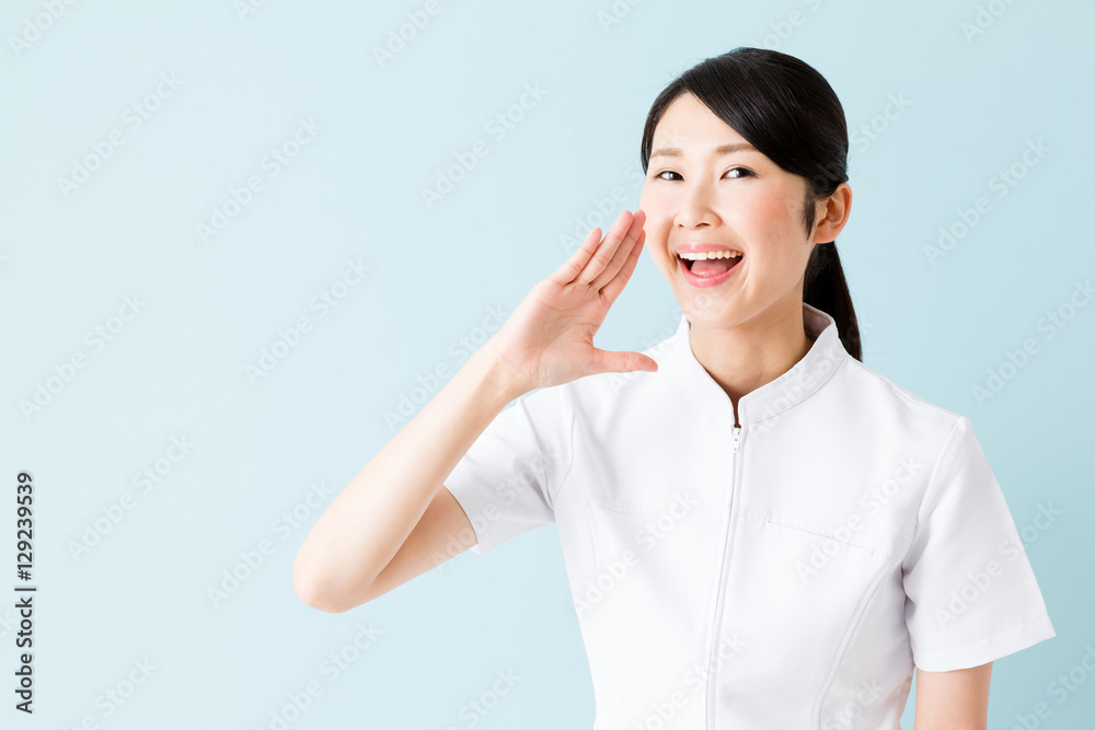 portrait of young asian nurse isolated on blue background portrait of young asian nurse isolated on blue background