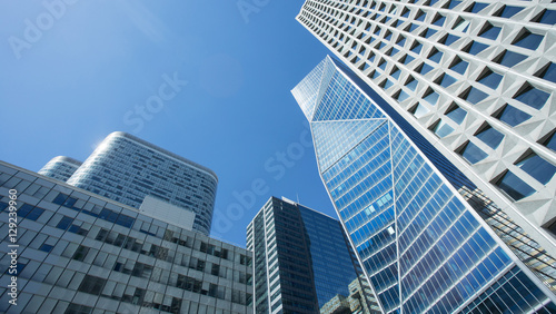Skyscrapers with glass facade. Modern buildings in Paris business district. Concepts of economics  financial  future.  Copy space for text. Dynamic composition. Toned