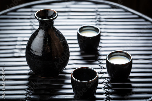 Delicious sake in Asian restaurant on black table