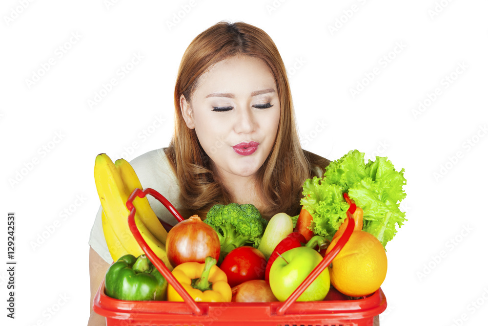 Beautiful woman holds vegetables Beautiful woman holds vegetables