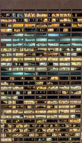 Office windows illuminated at night