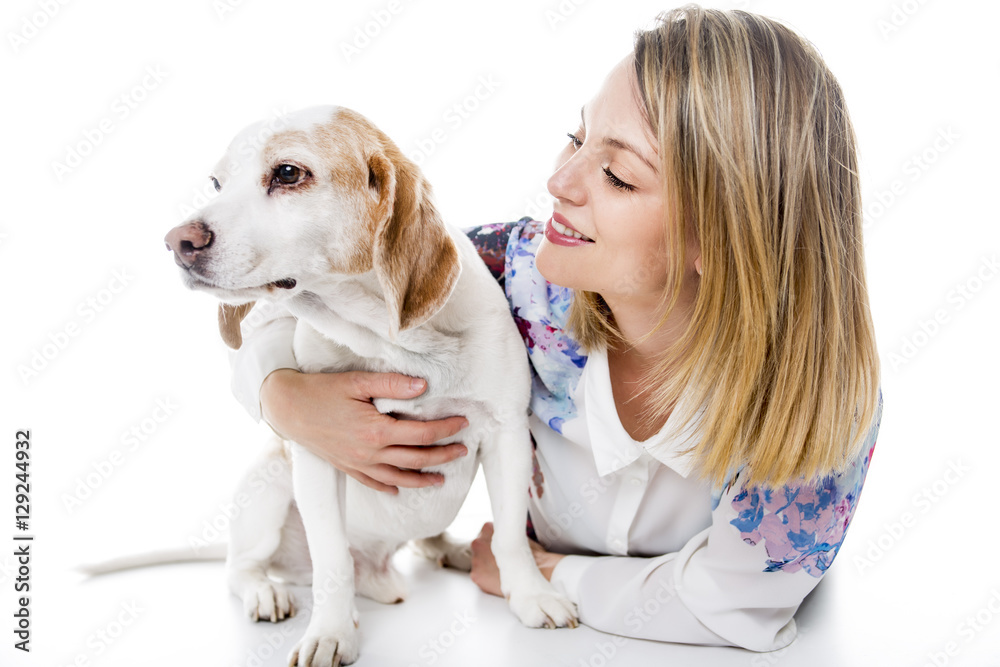 Dog with woman are posing in studio - isolated on white background Dog with woman are posing in studio - isolated on white background