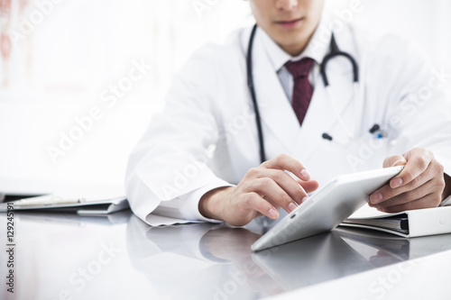 Doctor is watching electronic medical record
