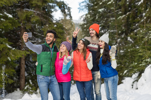 Man Hold Smart Phone Camera Taking Selfie Photo Snow Forest Young People Group Outdoor Winter Pine Woods