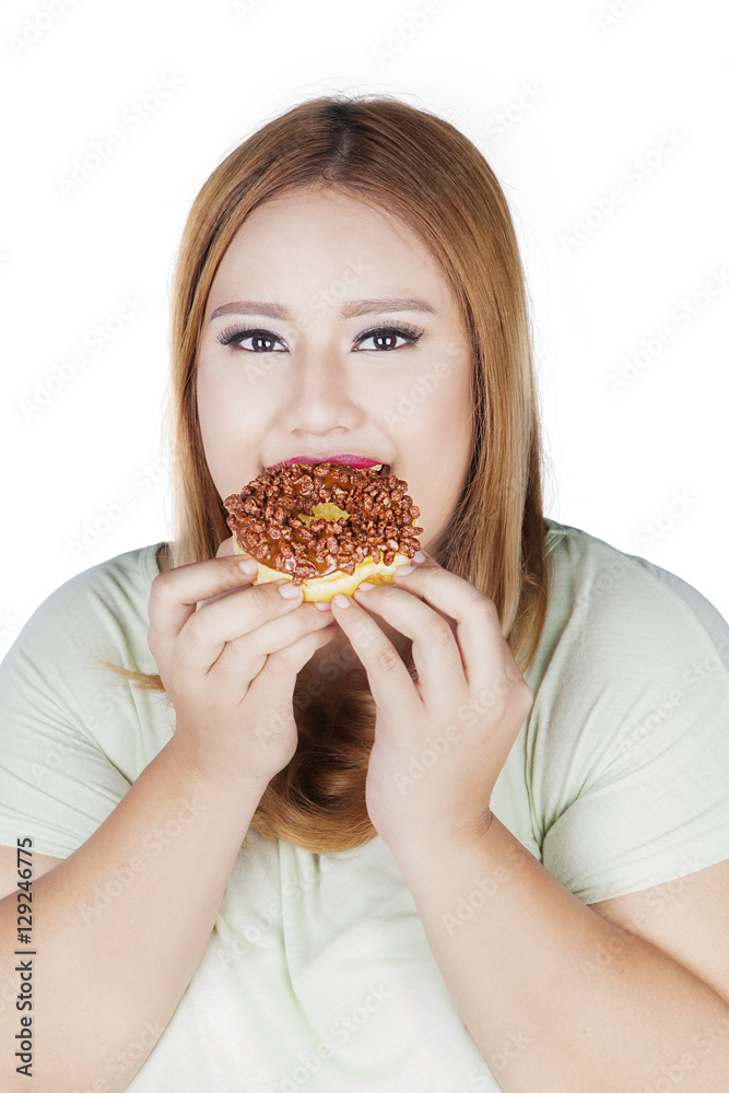 Pretty woman eating donut