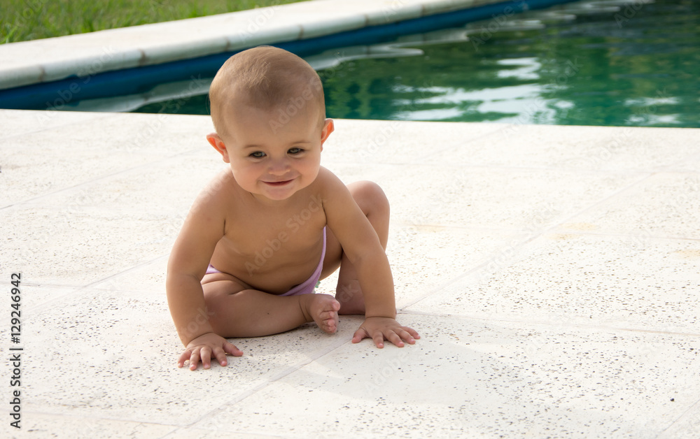 cute little baby eats strawberries by the pool cute little baby eats strawberries by the pool