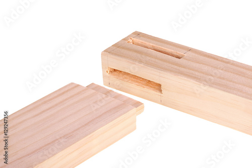 Fotografia, Obraz Close-up of boards with woodworking mortises and a tenon isolate