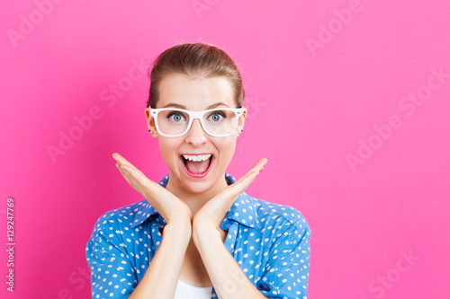 Surprised young woman posing