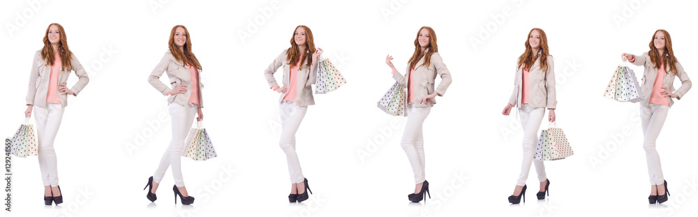 Young woman with shopping bags isolated on white Young woman with shopping bags isolated on white
