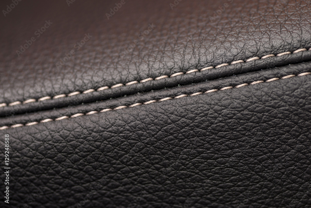 Leather background. Detail of car interior. Macro.