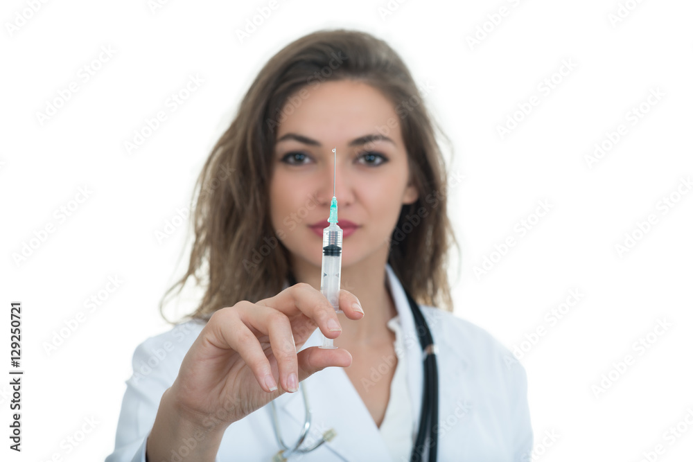 Female doctor checking a syringe isolated on white background Female doctor checking a syringe isolated on white background