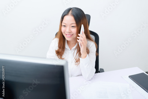 Young businesswoman working on computer.