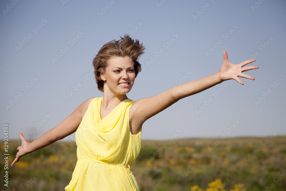 Happy fresh female enjoying the fresh air on nature