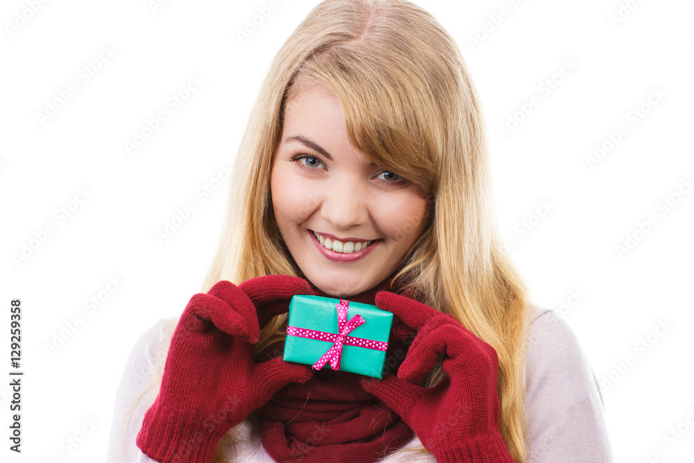 Fototapeta premium Woman holding wrapped gift for Christmas or other celebration