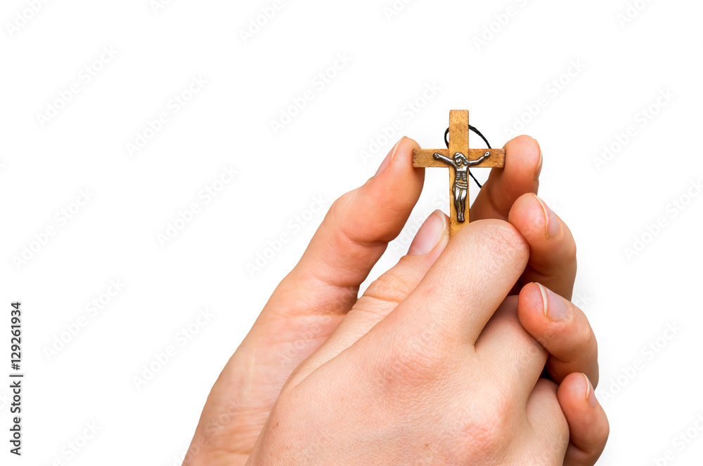Woman hands holding wooden cross isolated on white StockFoto Adobe Stock