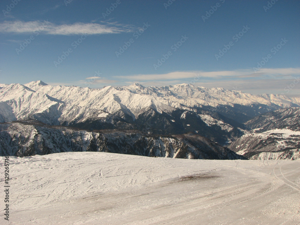 Sunny winter morning on ski slope in Greater Caucasus Mountain range, Georgia, region Mestia