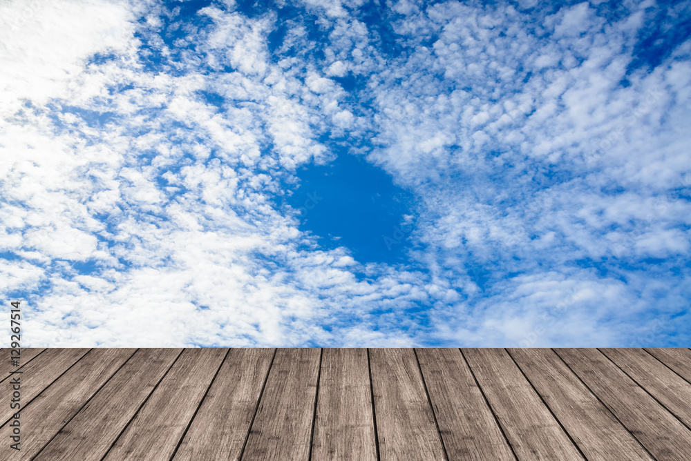 Wooden table or terrace on Deep blue sky and clouds. Space for y