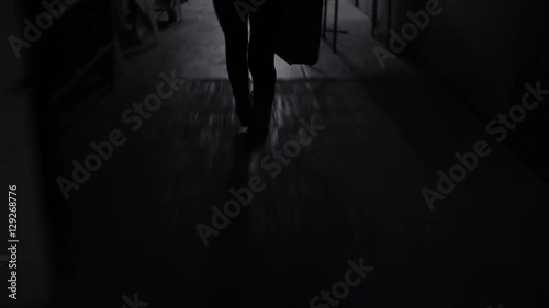Young business woman runs away with suitcase.