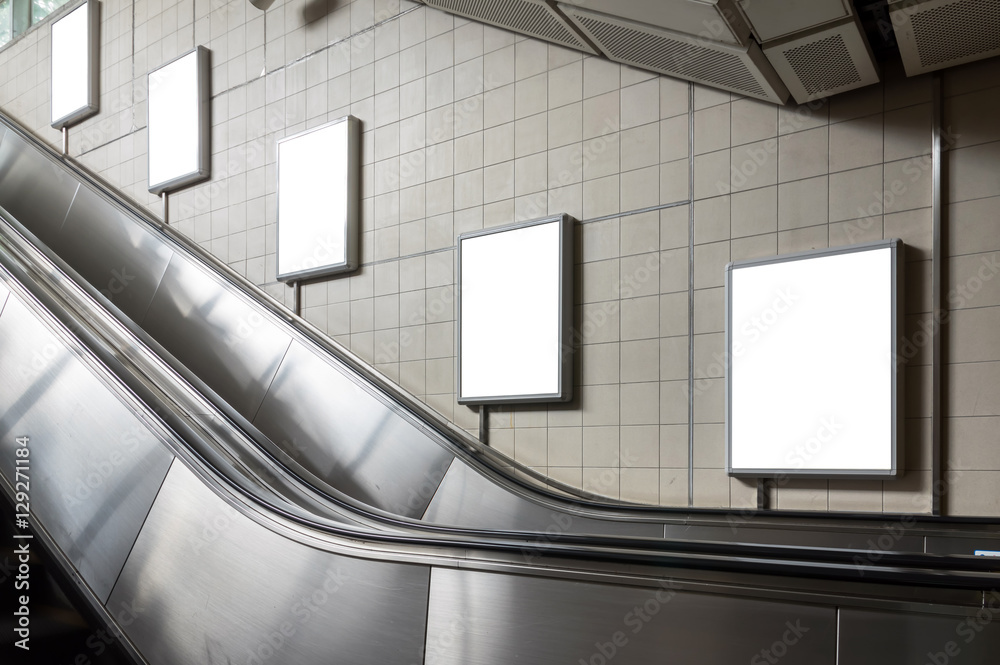Blank billboard located in underground hall or subway for advert