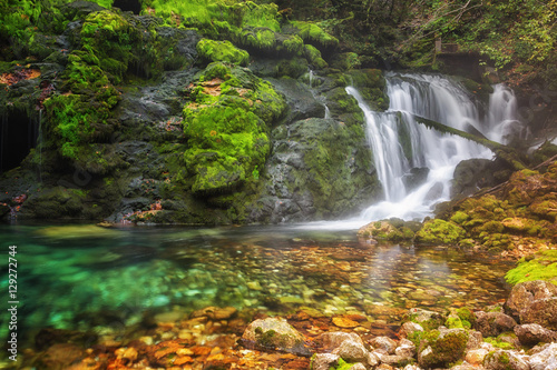 Fototapeta Naklejka Na Ścianę i Meble -  waterfall among rocks covered with green moss