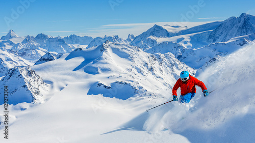 Skiing with amazing view of swiss famous mountains in beautiful photo