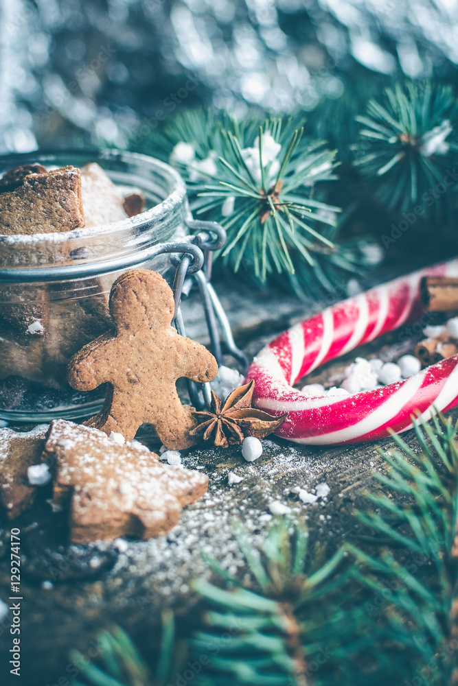 Christmas homemade gingerbread man cookies on wooden table
