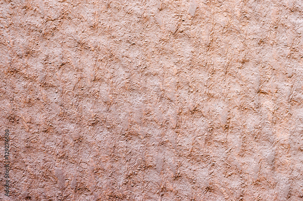 texture of brown cement background (selective focus at center)