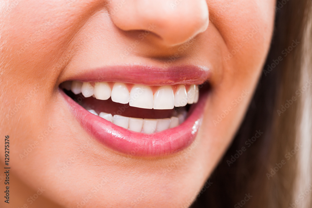 Close up image of perfect female teeth. Close up image of perfect female teeth.