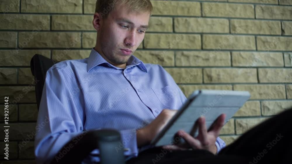 Young Businessman With Tablet Computer
Young Businessman With Tablet Computer