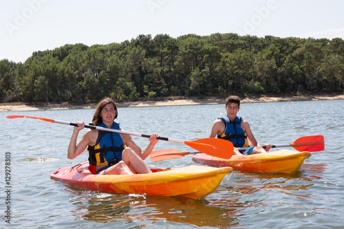 two kayak in à lake, mother and son in vacation