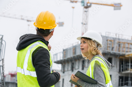 Construction engineers meeting on site