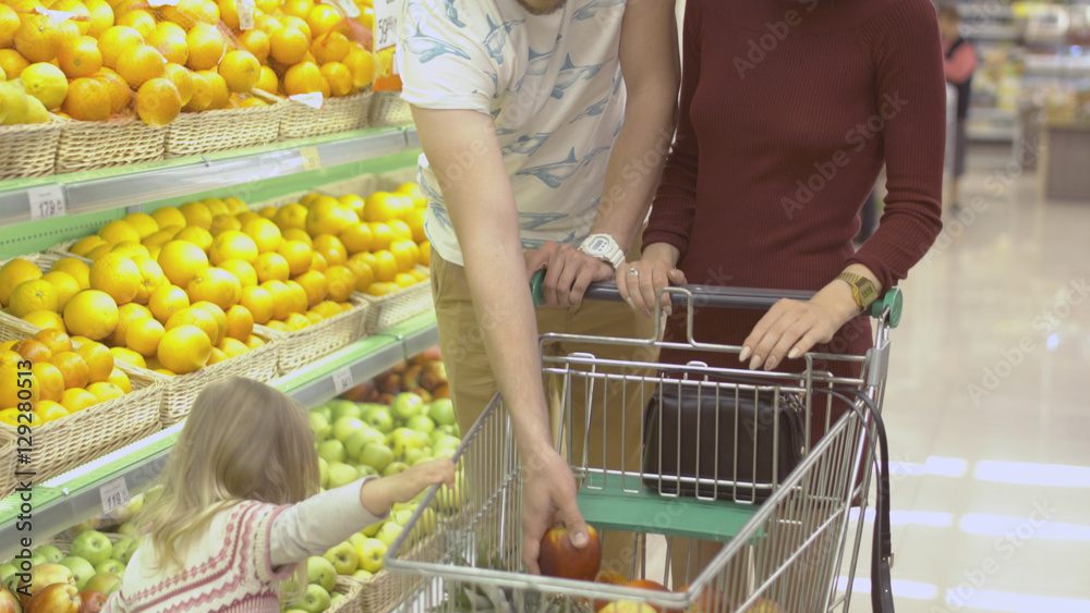 Family makes purchases in the supermarket